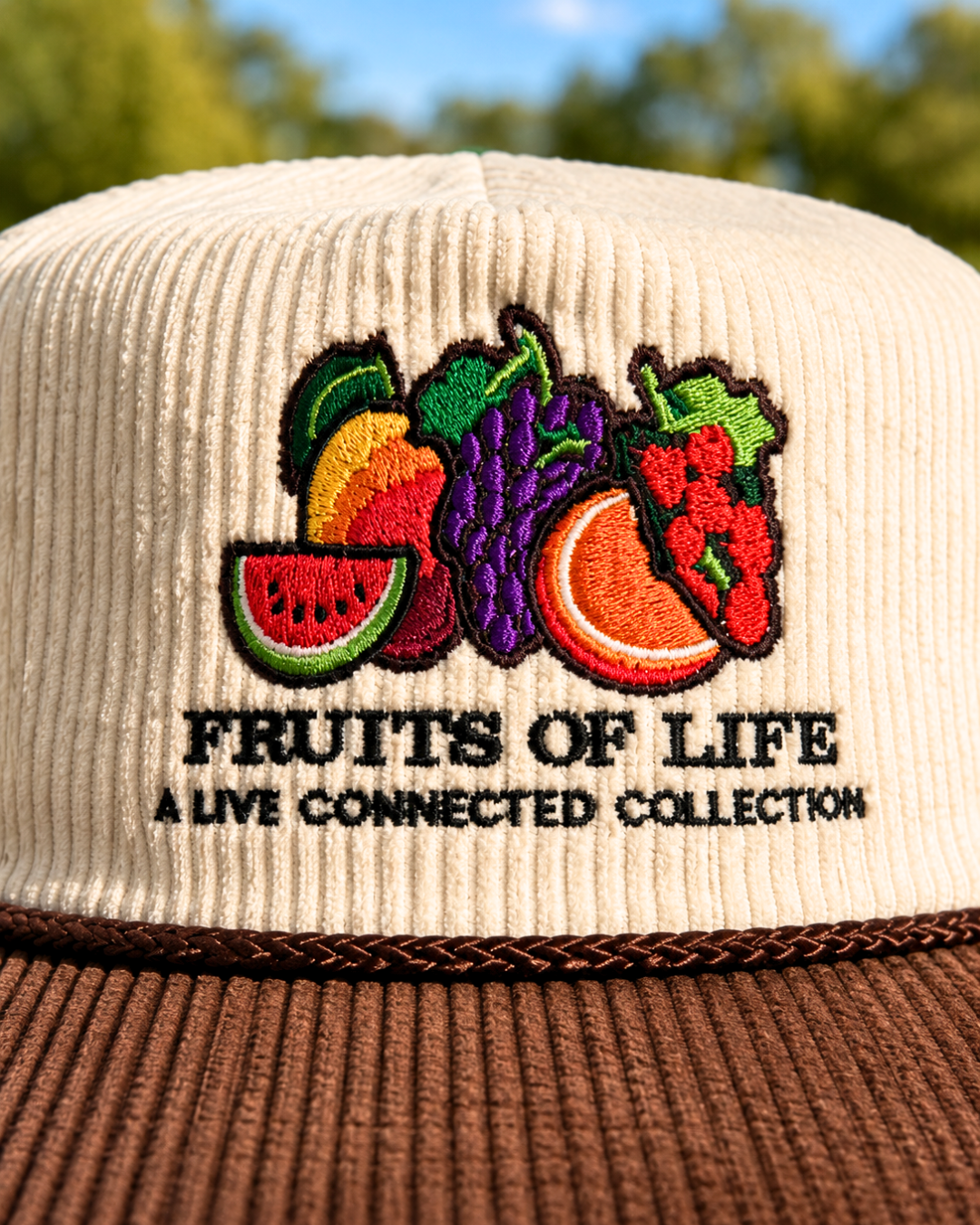Fruits of Life corduroy hat in cream and brown with embroidered fruit logo