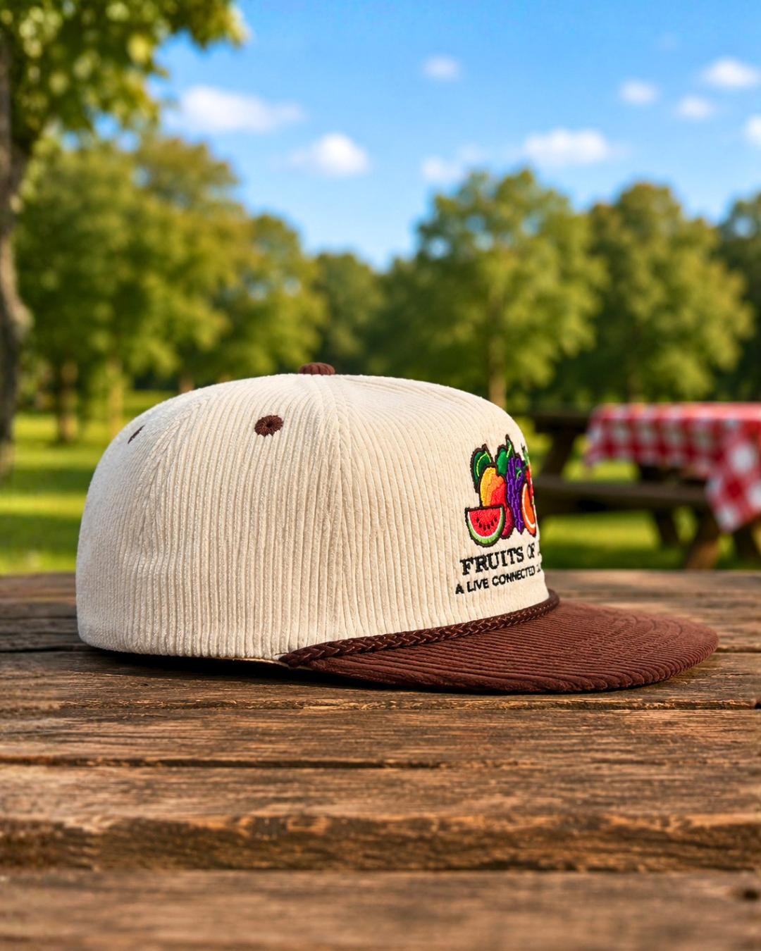 Fruits of Life corduroy hat in cream and brown with embroidered fruit logo